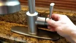 Removing set screw from moen faucet handle photographed on site during low water pressure causes work