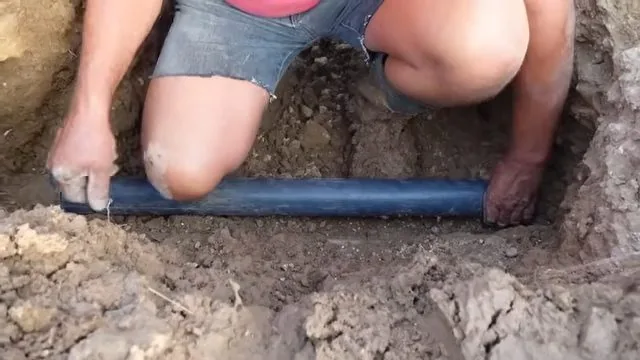 Measuring burst water line in excavation, part of a signs you need a plumber now visit in Chapel Hill, NC