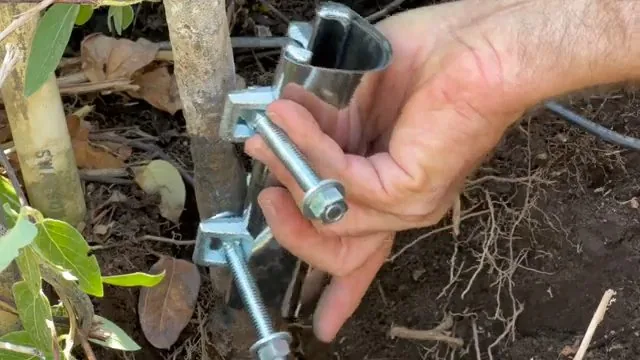 Close view of metal sprinkler pipe leak repair wrap handled during a signs you need a plumber now appointment
