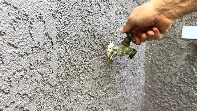 Closing repaired outdoor faucet, part of a fixing a running toilet visit in Chapel Hill, NC
