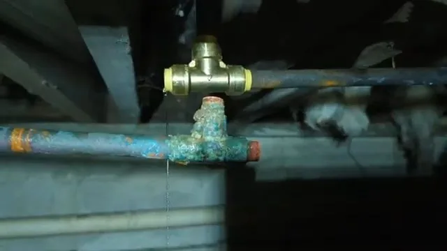 Cutting frozen copper pipe near foundation captured mid-repair on a Chapel Hill before the plumber arrives job