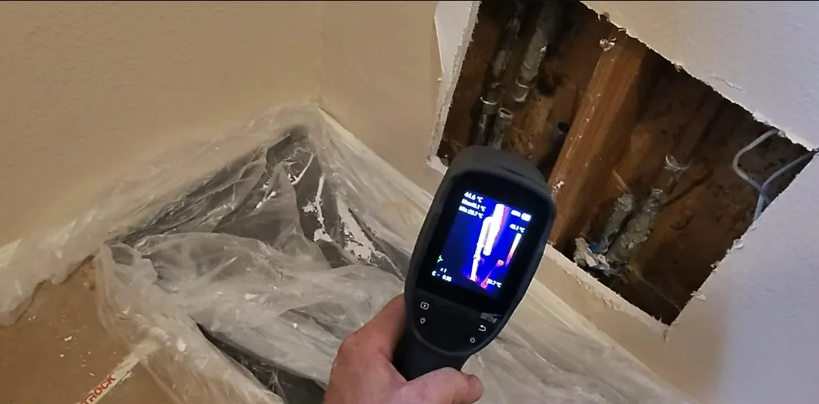 Digital leak detector screen over floor, documented during rising water bill causes service in the Chapel Hill area